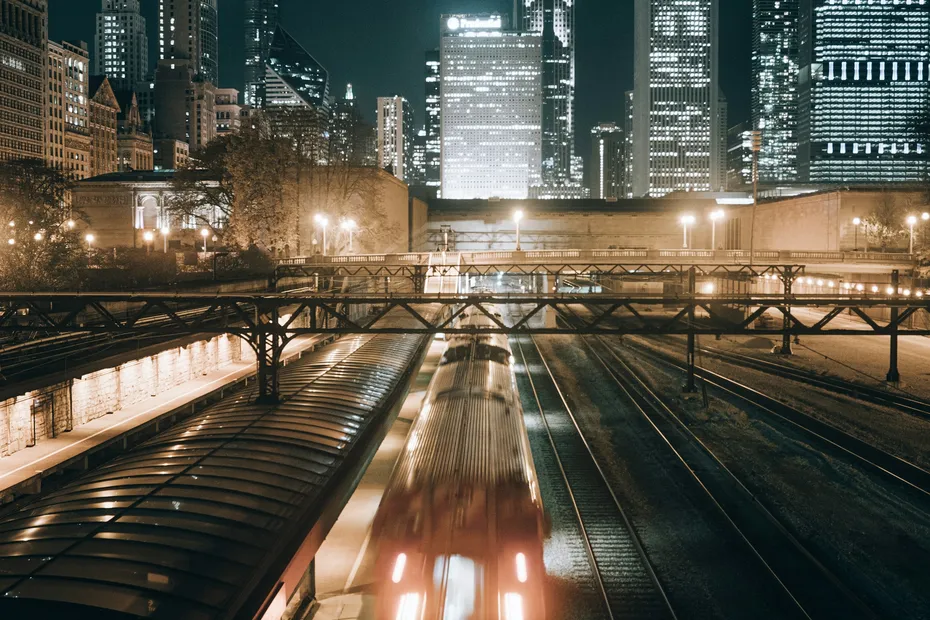 Chicago skyline and elevated train at night