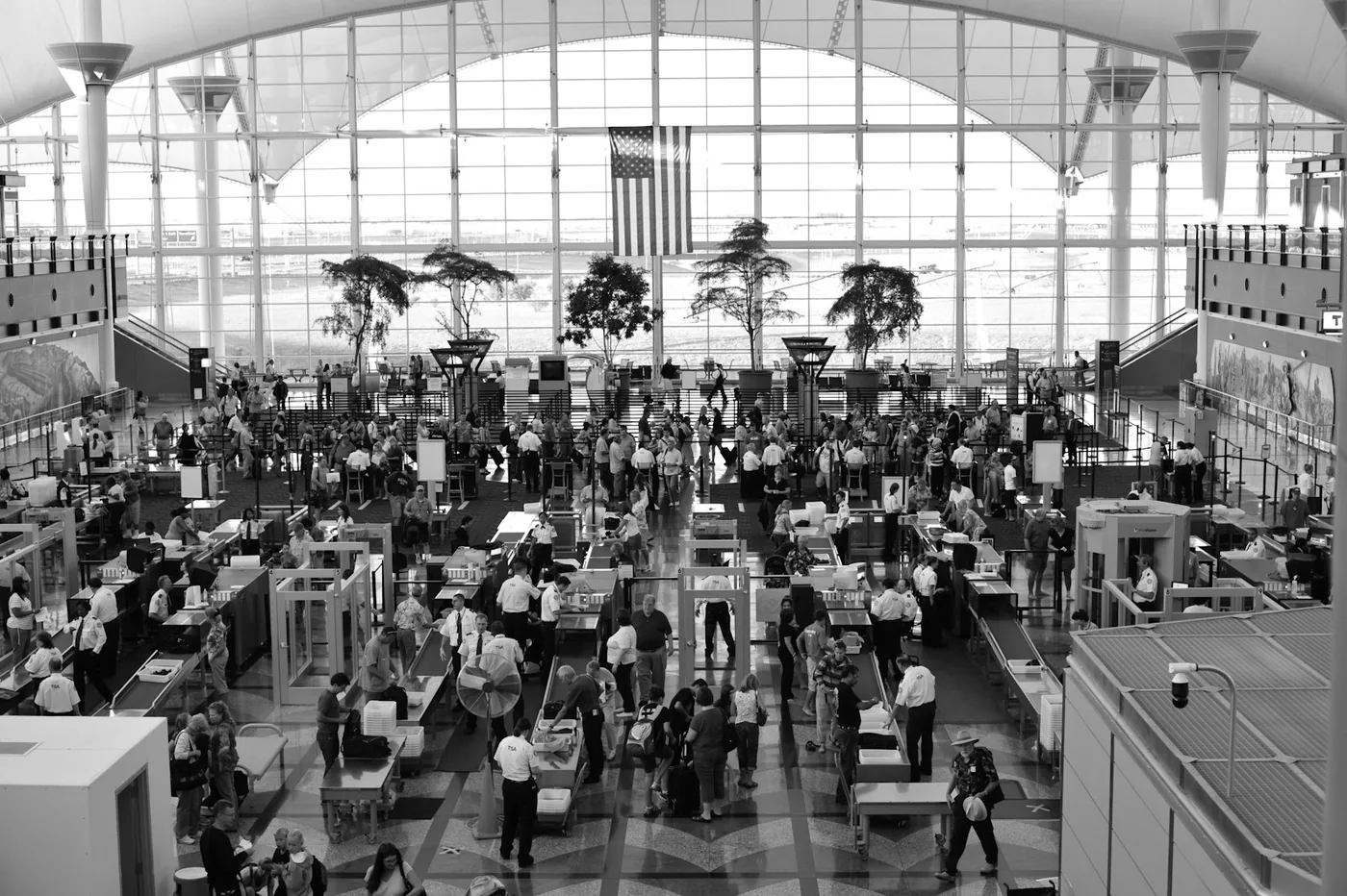 Travelers moving through the security checkpoint at Denver International Airport