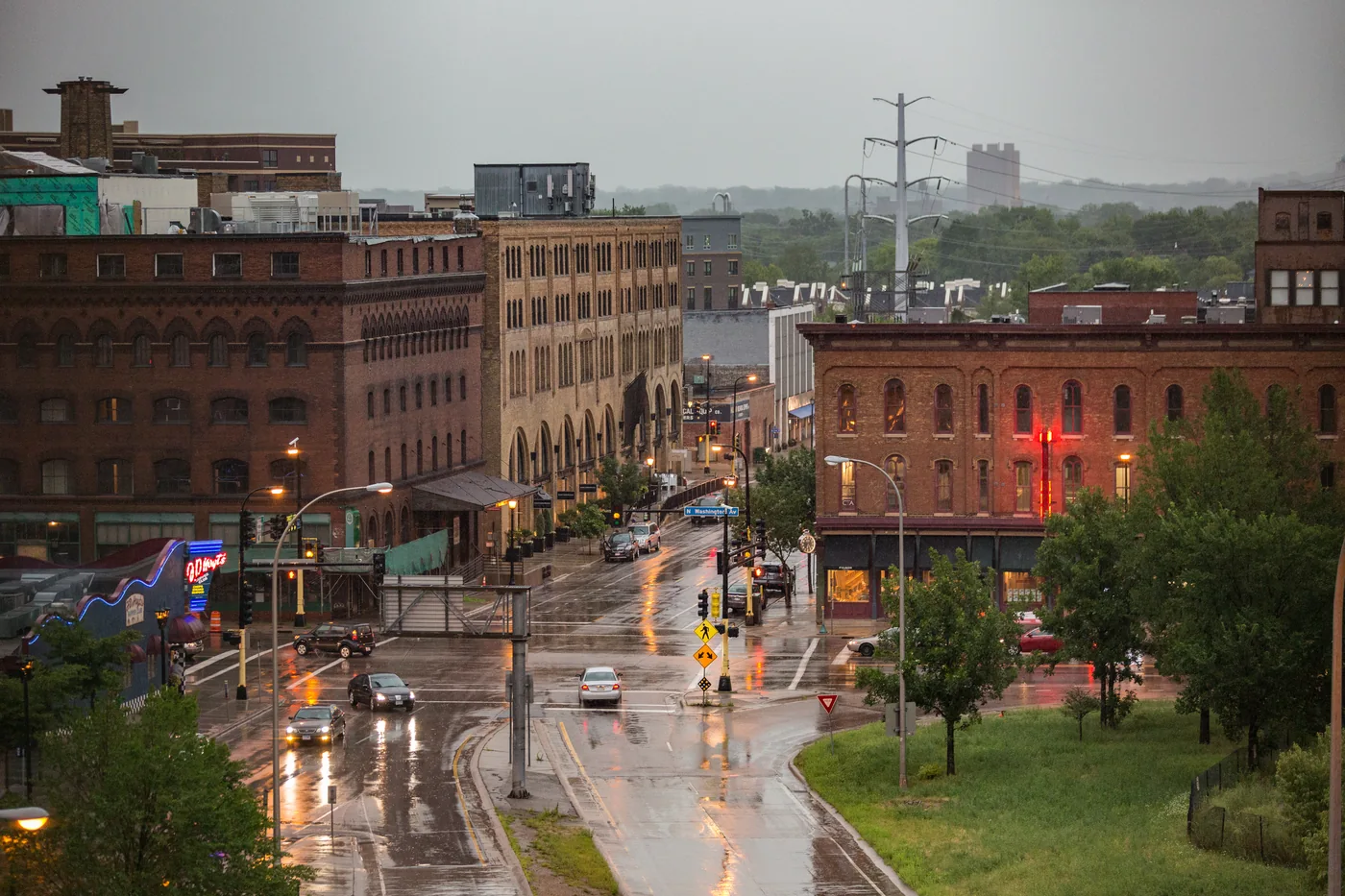 Brick warehouse buildings along Washington Avenue in Minneapolis's North Loop on a rainy evening