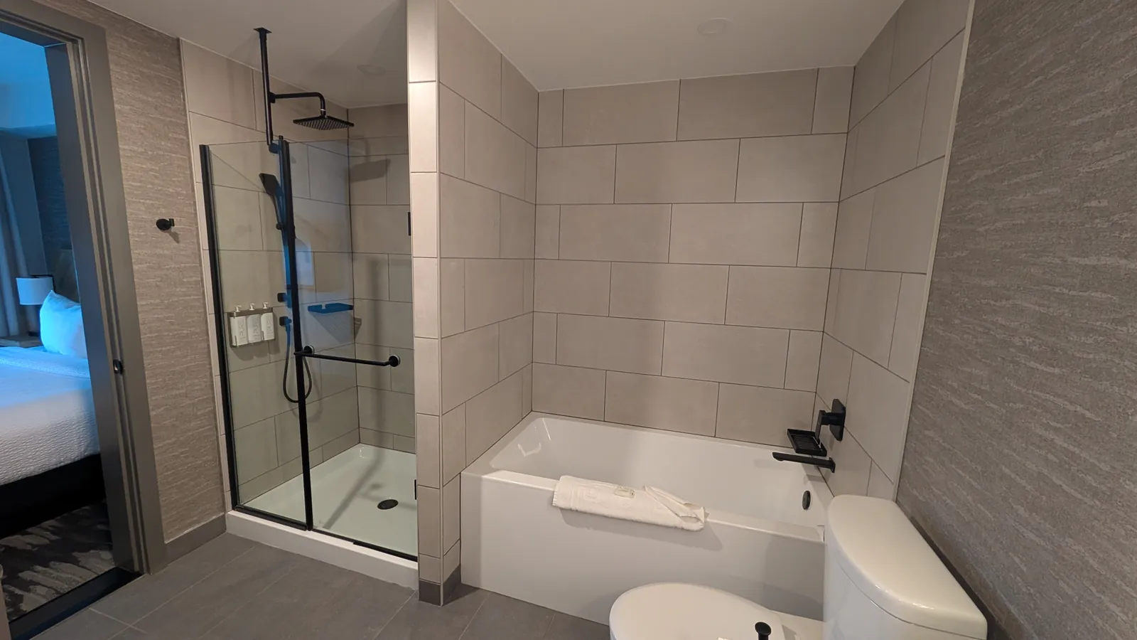 Bathroom with the glass walk-in shower and soaking tub
