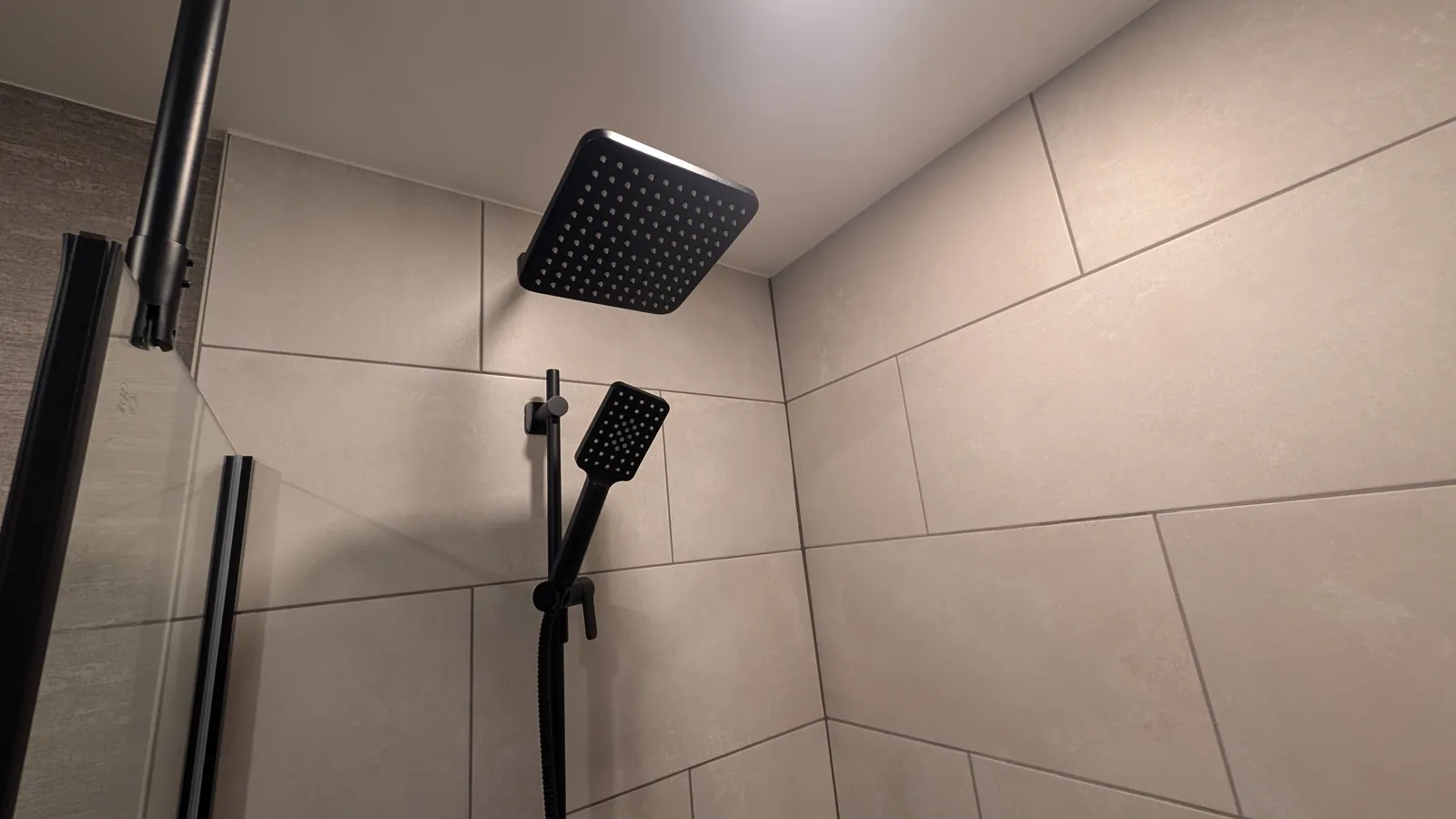 Square rain shower head and handheld wand.
