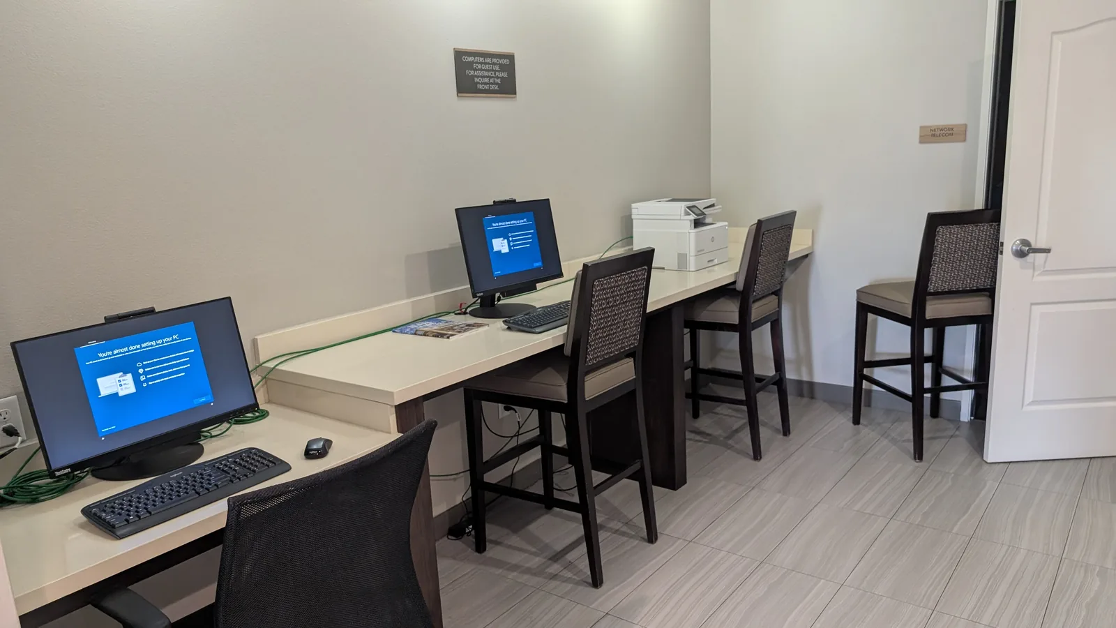 Guest computers and desks in the hotel's business center