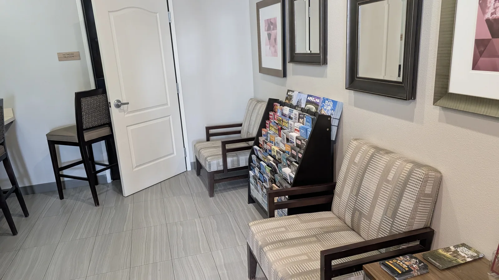 Tables and lounge chairs in the business center.