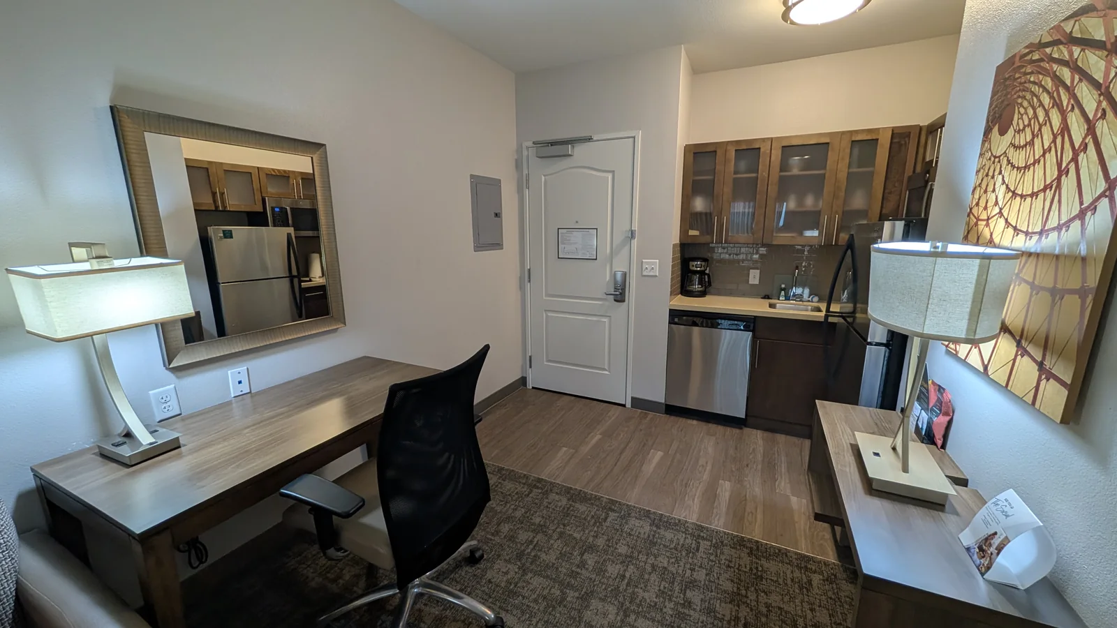 The studio suite work desk and kitchenette.