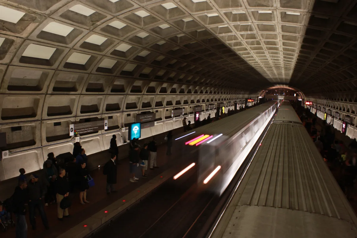 Train entering a vaulted Washington Metro station